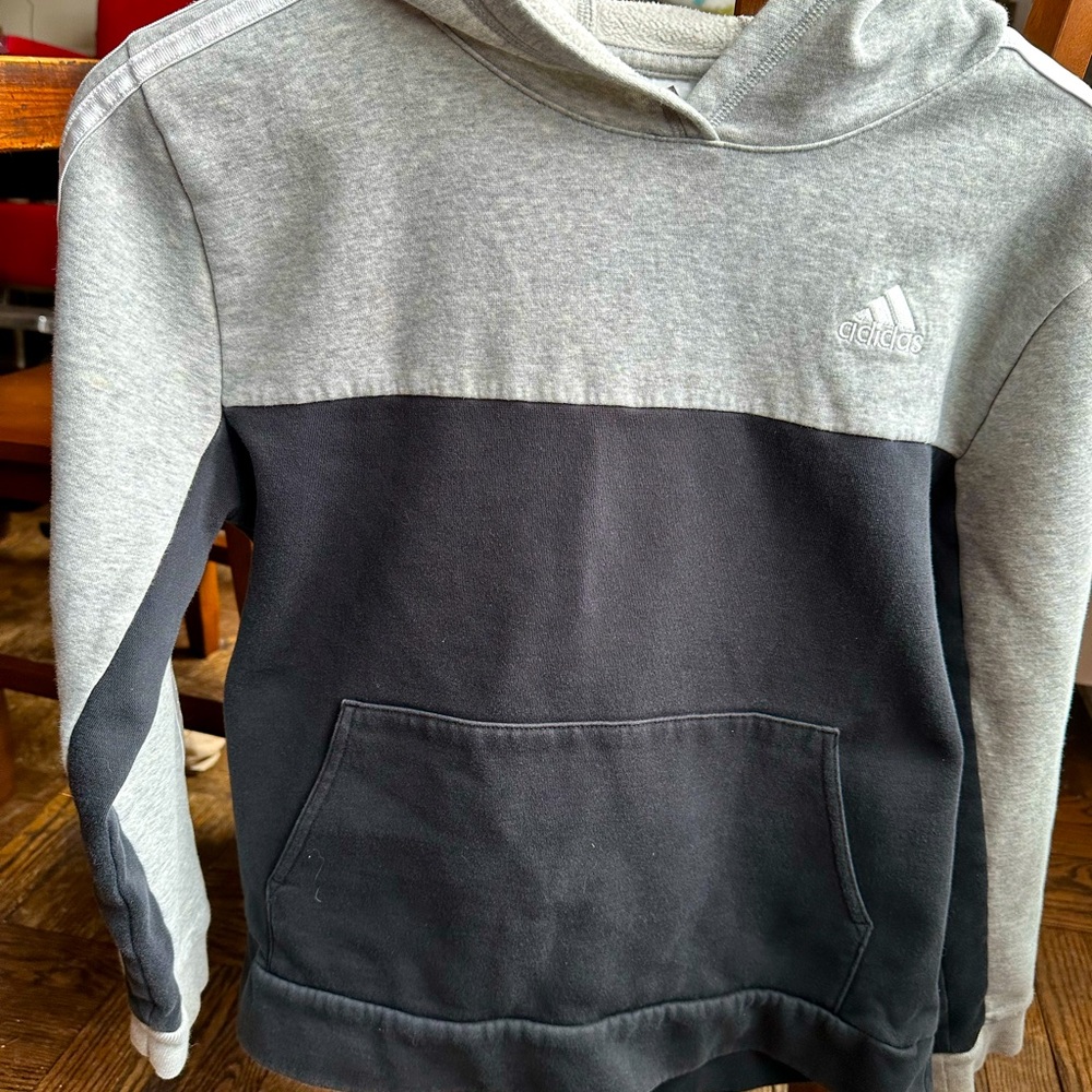Adidas grey W/ black below chest hoodie with small Adidas logo. Large 14/16 kids